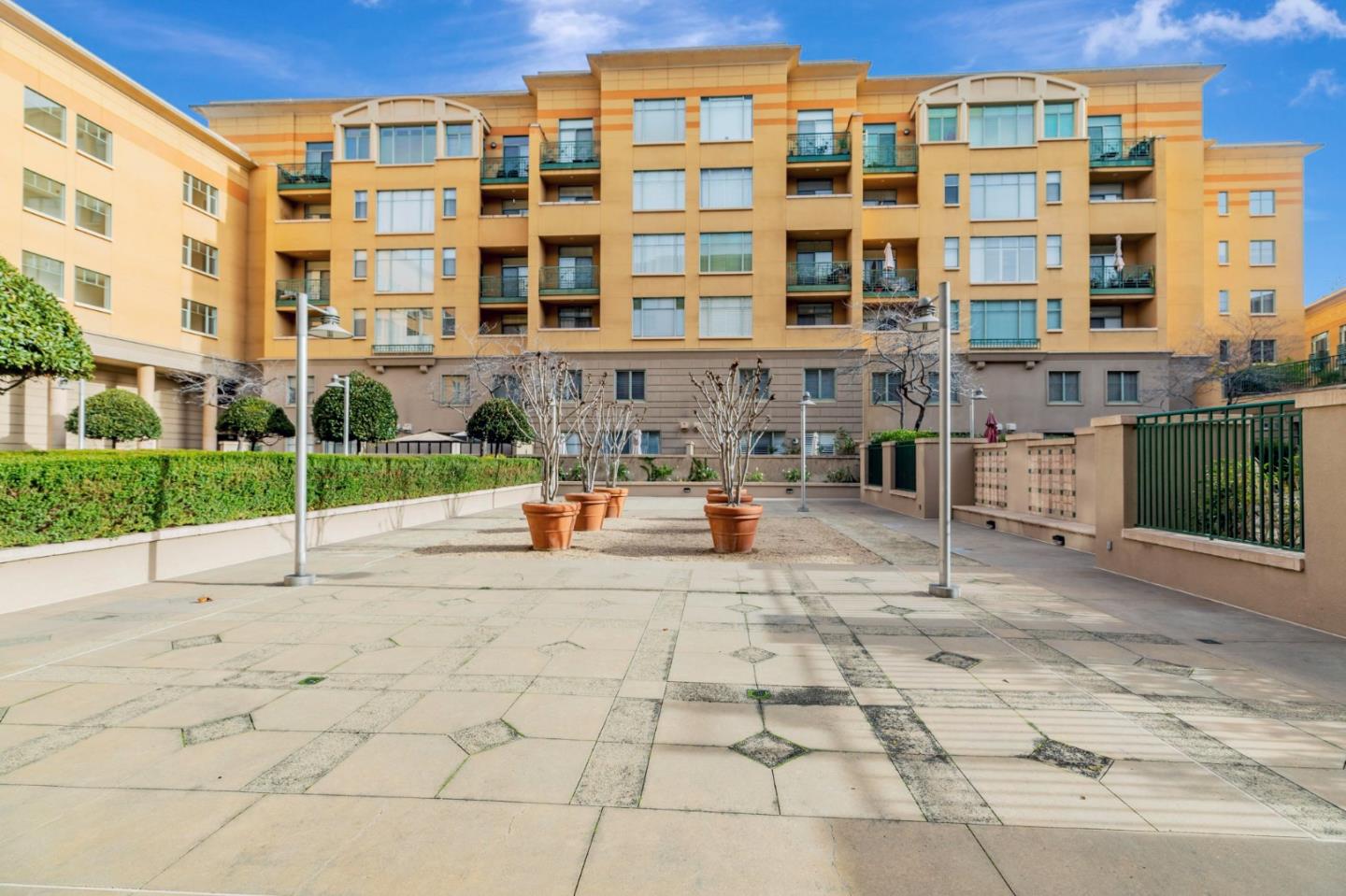 144 South 3rd Street, Unit 433 San Jose, CA 95112 - Photo 55 of 66 a view of tall building with a bench in front of building