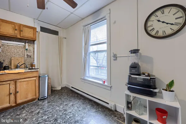 a view of a hallway with washer and dryer