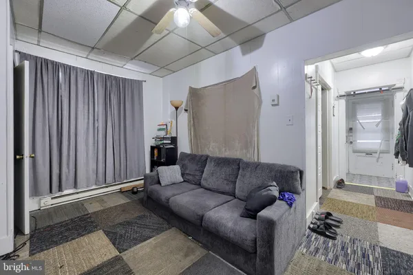 a living room with furniture and a rug