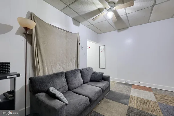 a living room with furniture and a rug