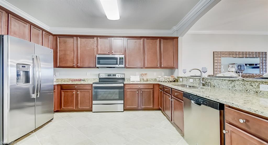 14916 Anchorage Road Punta Gorda, FL 33982 - Photo 4 of 20 a kitchen with stainless steel appliances granite countertop a stove top oven a sink and dishwasher