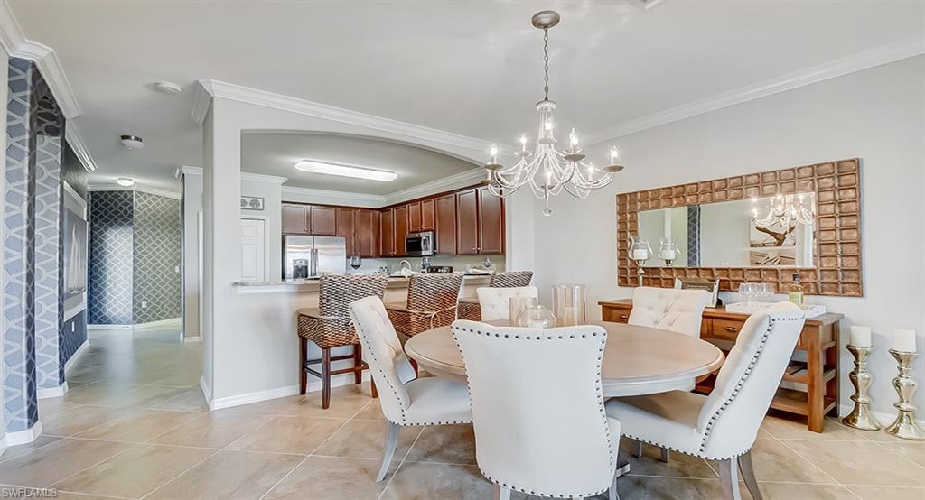 14916 Anchorage Road Punta Gorda, FL 33982 - Photo 8 of 20 a view of a dining room with furniture and chandelier
