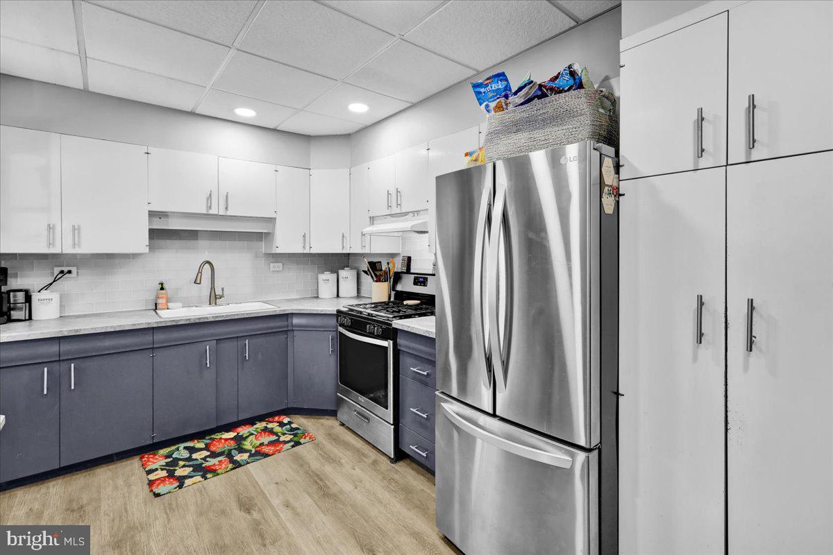 830 Lake Street Lancaster, PA 17603 - Photo 11 of 20 a kitchen with stainless steel appliances granite countertop a refrigerator sink and cabinets