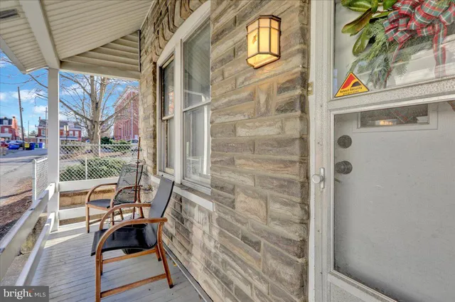 a view of entryway with wooden door