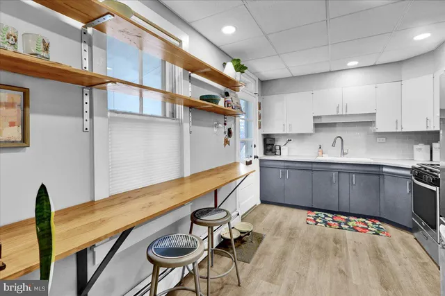 a kitchen with stainless steel appliances granite countertop a sink and cabinets