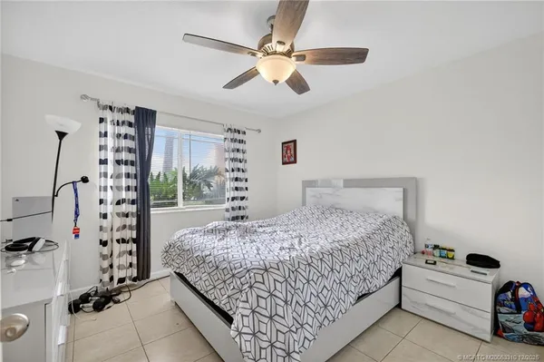 a bedroom with bed and a large walk in closet