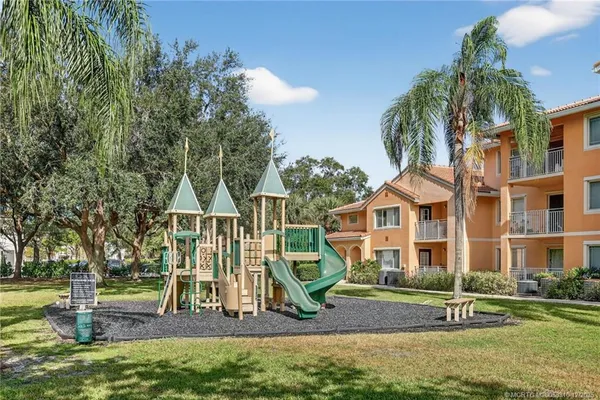 a view of a house with a yard and plants