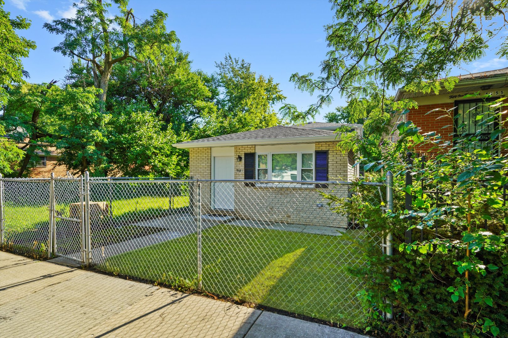 5151 South Emerald Avenue Chicago, IL 60609 - Photo 13 of 24 a view of a house with a backyard