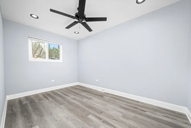 a view of room with window and ceiling fan