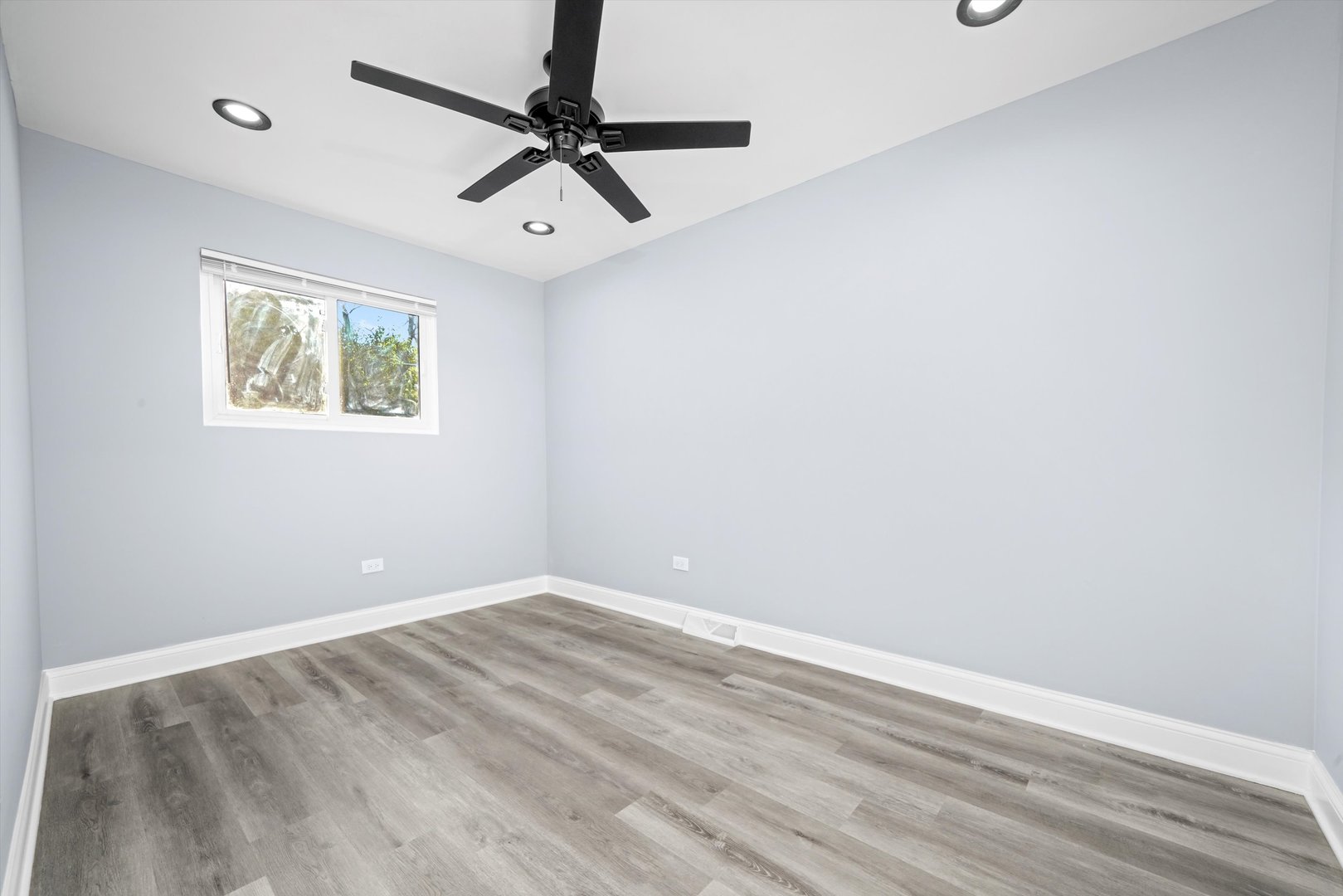 5151 South Emerald Avenue Chicago, IL 60609 - Photo 21 of 24 a view of room with window and ceiling fan