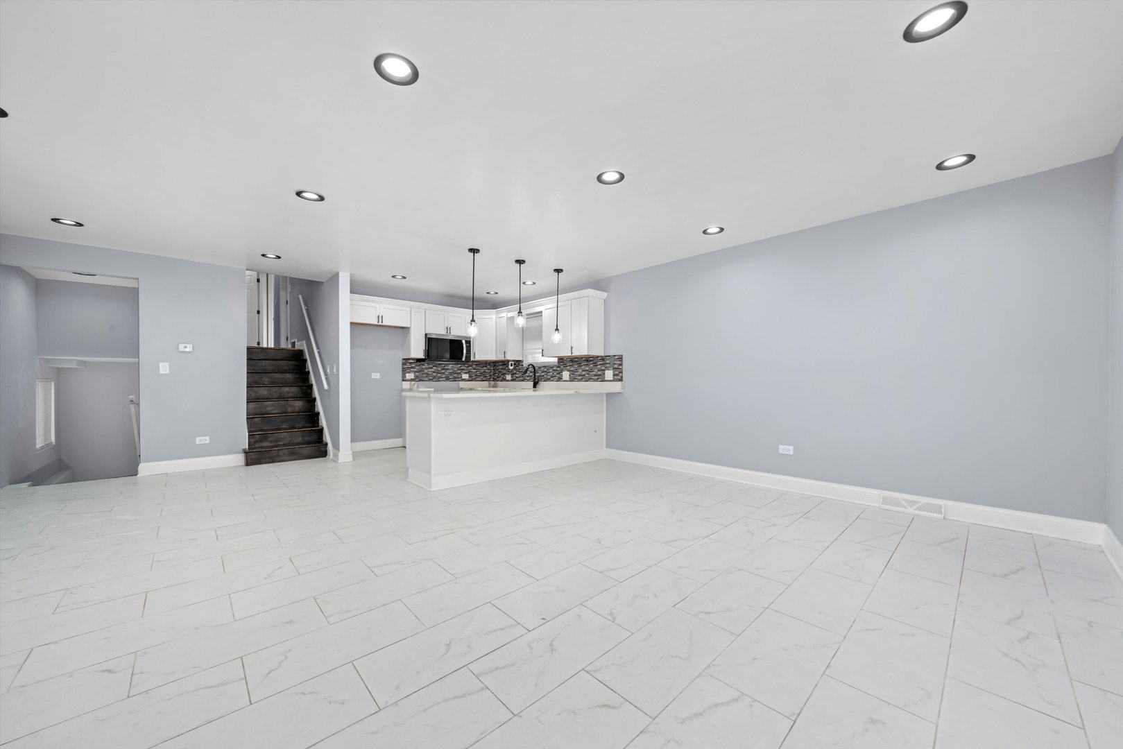 5151 South Emerald Avenue Chicago, IL 60609 - Photo 4 of 24 a view of a kitchen with white cabinets