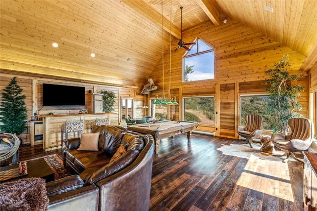 a swimming pool view with a seating space