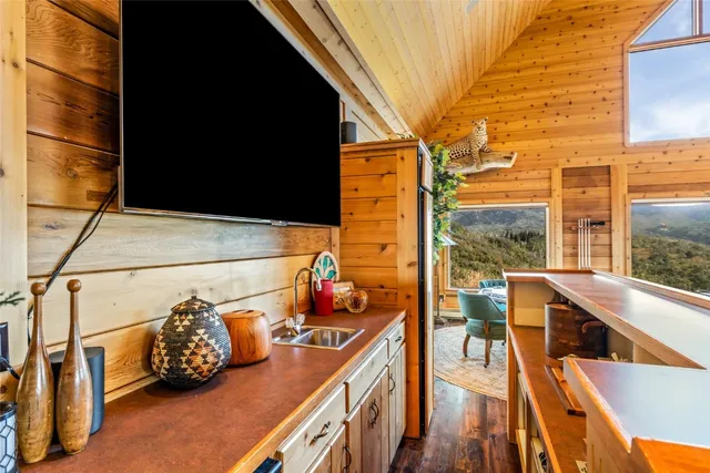 a living room with furniture and a bookshelf