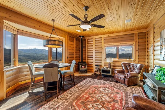 a kitchen with granite countertop a sink and a large window