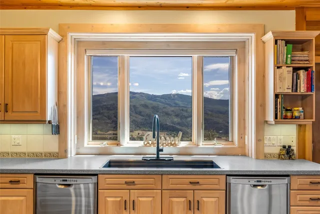 a bathroom with a mirror a sink and a mirror