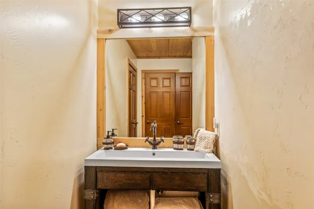 a bedroom with furniture and wooden floor