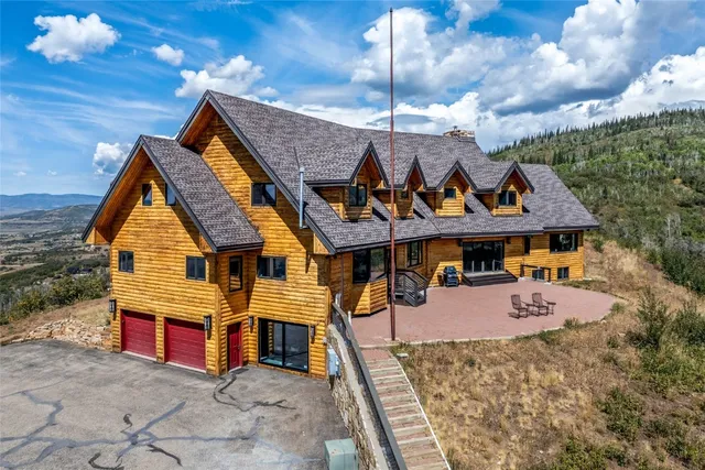a view of a house with roof deck front of house