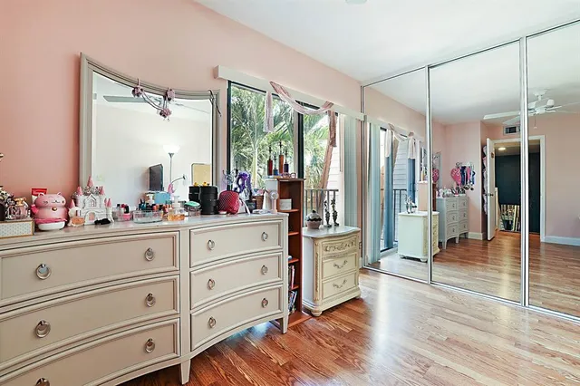 a bathroom with a double vanity sink a mirror and shower