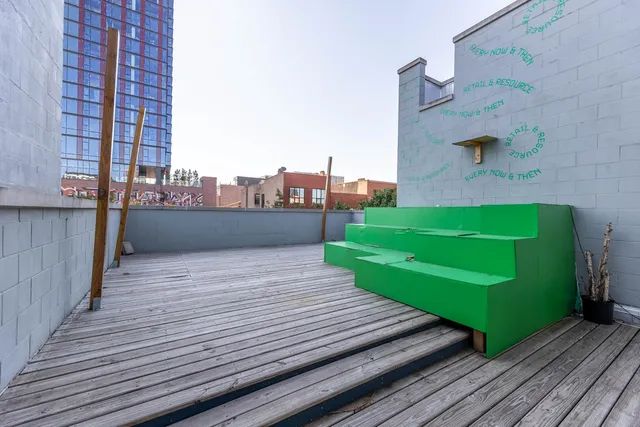 a view of a balcony with wooden floor