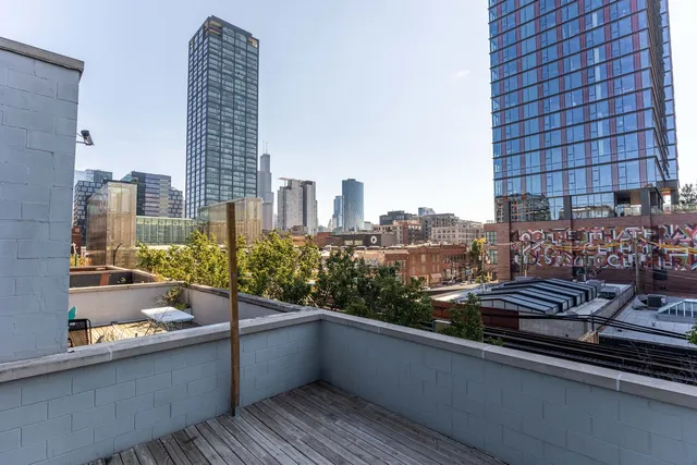 a view of roof deck with city view