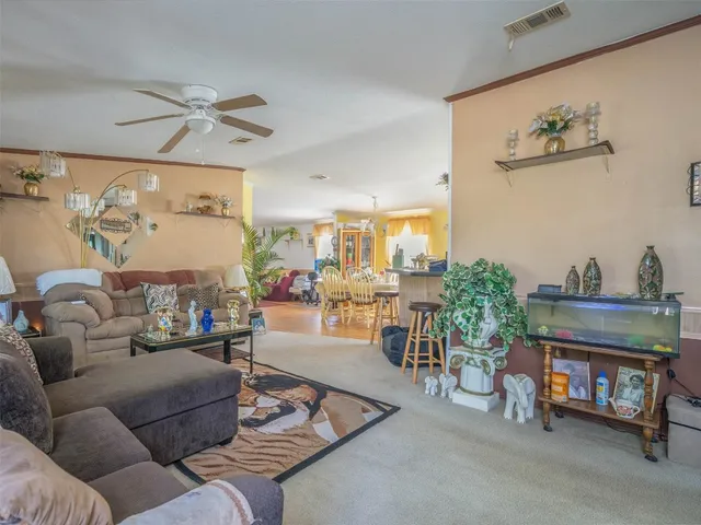 a living room with furniture and a table