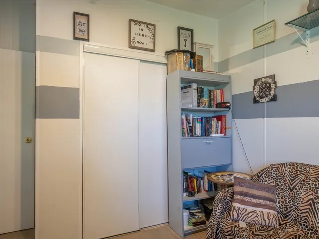 a room with furniture and a book shelf