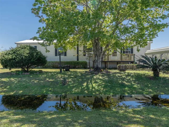 a backyard of a house with lots of green space