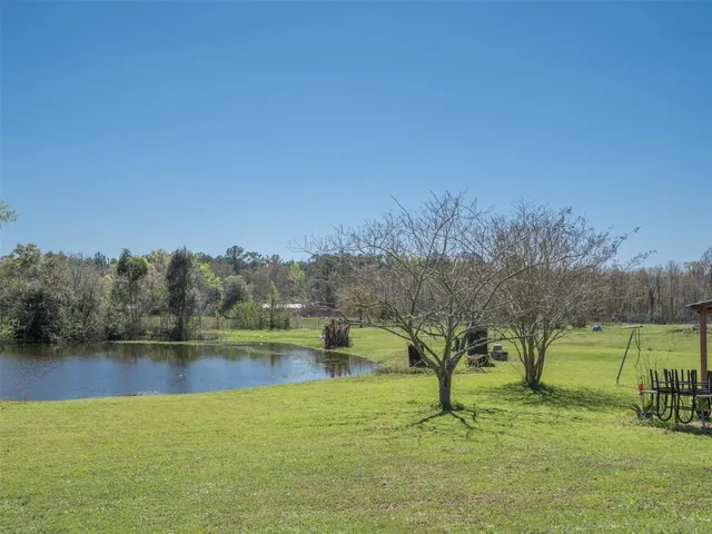 a view of lake with green field