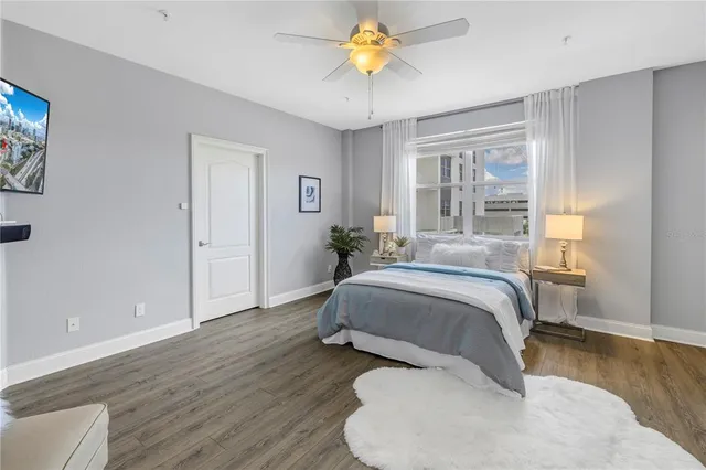 a bedroom with a bed dresser and a window