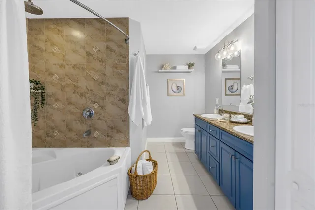 a bathroom with a bathtub sink and toilet