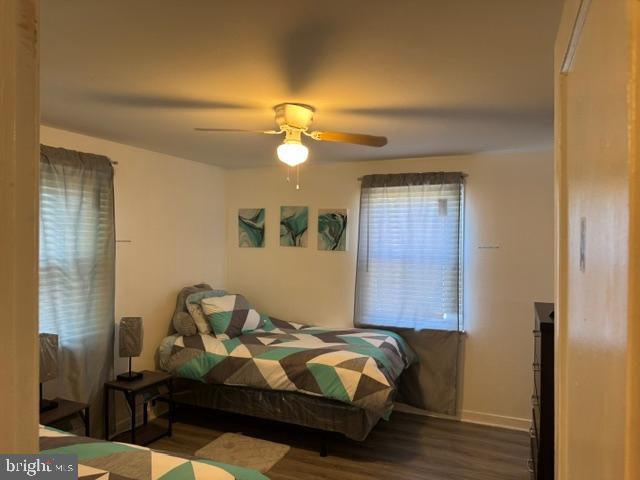 4603 Raleigh Road Temple Hills, MD 20748 - Photo 31 of 40 a bedroom with a bed and wooden floor