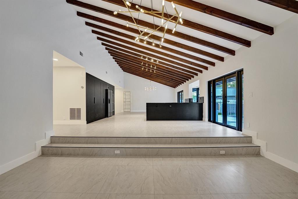 3501 North Park Road Hollywood, FL 33021 - Photo 12 of 55 a bedroom with a large bed and a chandelier