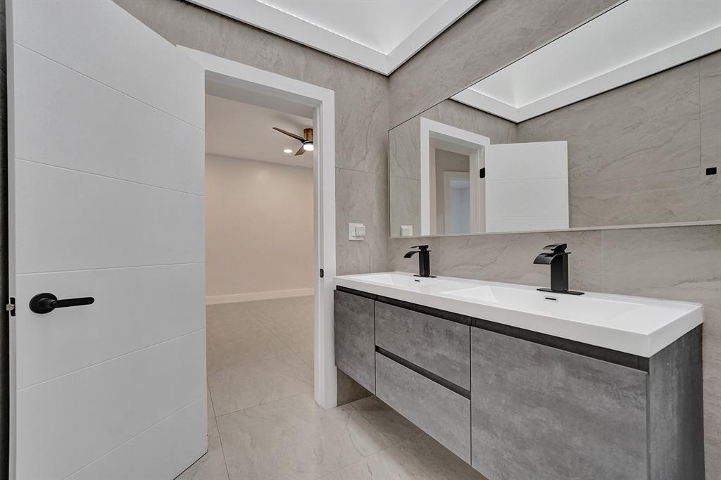 3501 North Park Road Hollywood, FL 33021 - Photo 25 of 55 a bathroom with a sink and a mirror