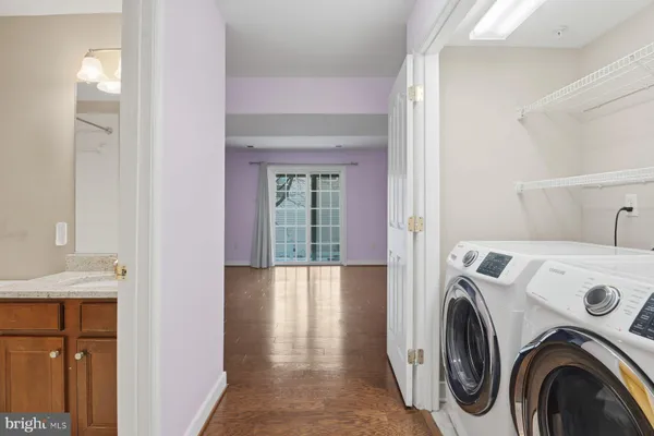 a view of storage and utility room with washer and dryer