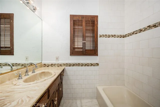 a bathroom with a sink and a bathtub