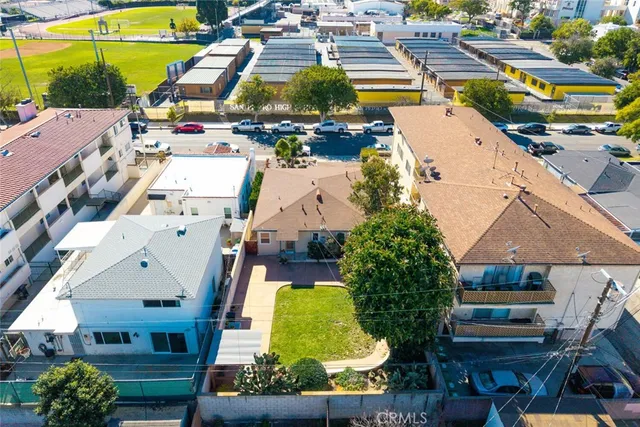 an aerial view of a house with a swimming pool outdoor seating and yard