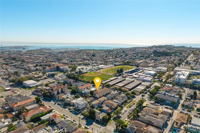 an aerial view of a house with a swimming pool