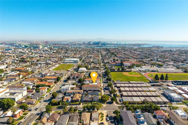 an aerial view of residential building and lake