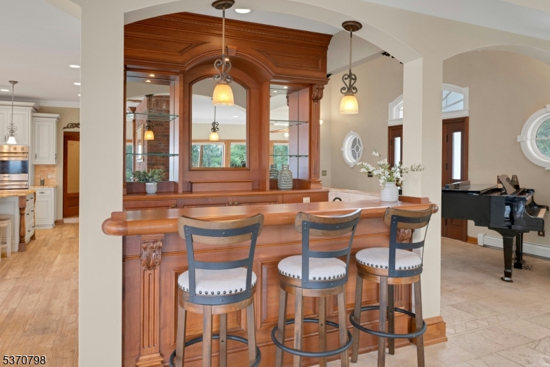 656 Lakeside Avenue Hopatcong, NJ 07821 - Photo 18 of 36 a view of a dining room with furniture and a chandelier