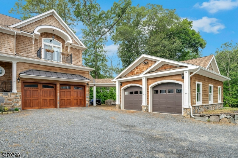 656 Lakeside Avenue Hopatcong, NJ 07821 - Photo 2 of 36 a front view of a house with a yard and garage