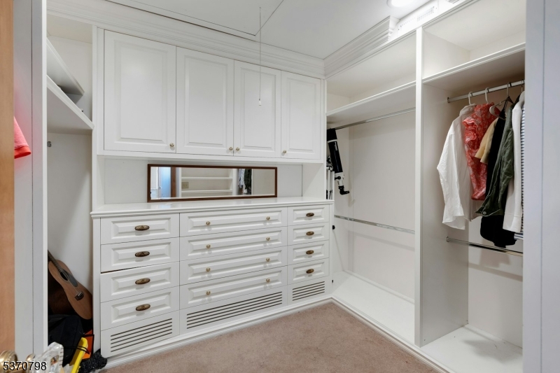 656 Lakeside Avenue Hopatcong, NJ 07821 - Photo 25 of 36 a view of walk in closet with clothes