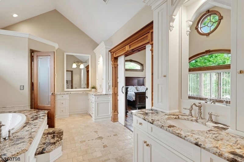 656 Lakeside Avenue Hopatcong, NJ 07821 - Photo 27 of 36 a bathroom with a granite countertop sink and a mirror