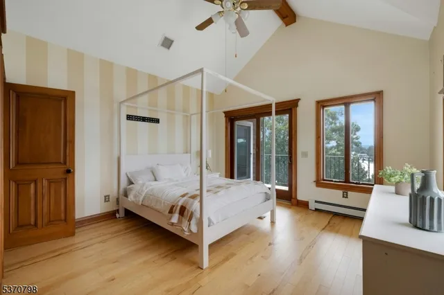 a bedroom with a bed and a television