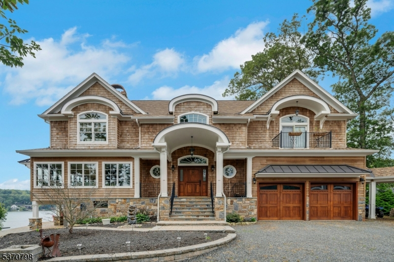 656 Lakeside Avenue Hopatcong, NJ 07821 - Photo 3 of 36 a front view of a house with garden