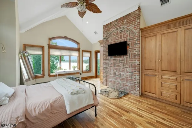 a living room with a bed furniture and a large window