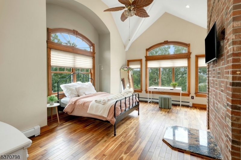 656 Lakeside Avenue Hopatcong, NJ 07821 - Photo 32 of 36 a living room with a bed furniture and a large window