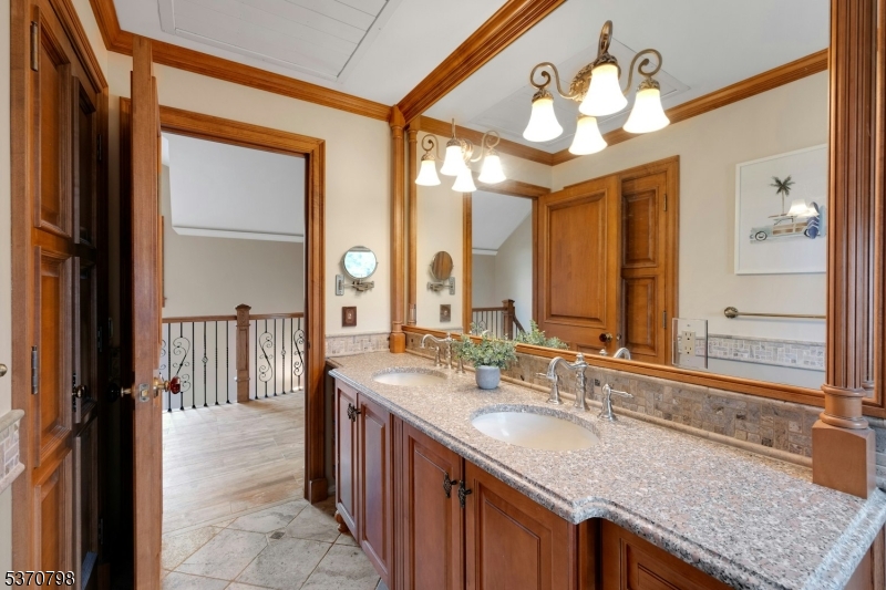 656 Lakeside Avenue Hopatcong, NJ 07821 - Photo 34 of 36 a bathroom with a granite countertop sink and a mirror