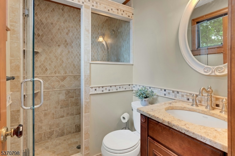 656 Lakeside Avenue Hopatcong, NJ 07821 - Photo 35 of 36 a bathroom with a granite countertop sink toilet and shower