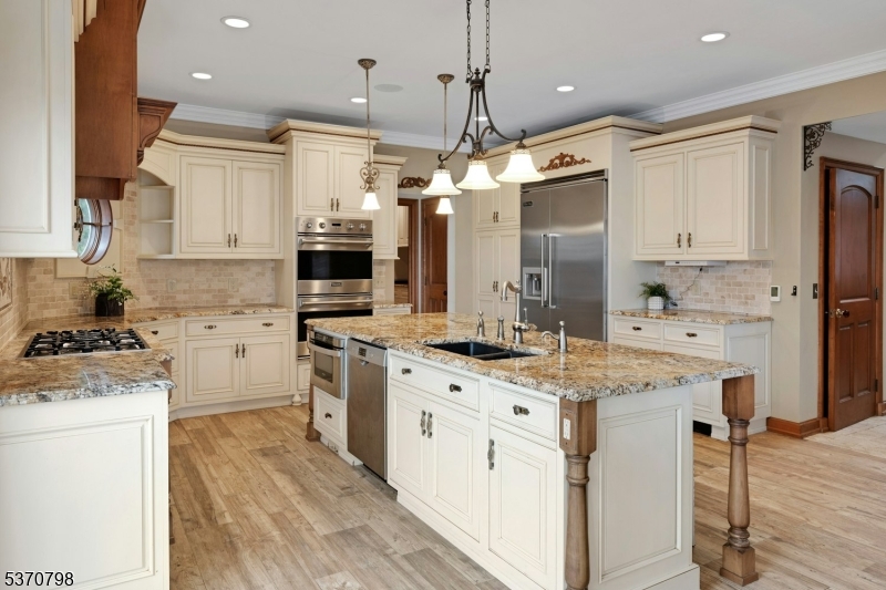 656 Lakeside Avenue Hopatcong, NJ 07821 - Photo 9 of 36 a kitchen with kitchen island granite countertop a sink stainless steel appliances and cabinets