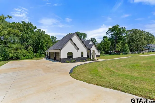 a bathroom with a toilet sink and shower